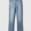 Jeans slim vintage a vita media con orlo a spacco