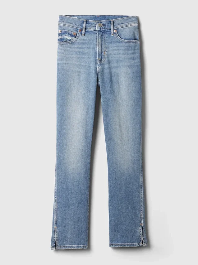 Jeans slim vintage a vita media con orlo a spacco