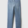 Jeans slim vintage a vita media con orlo a spacco
