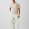 Maglia polo oversize con tasca e zip a un quarto