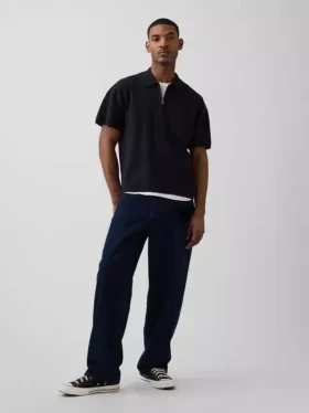Maglia polo oversize con tasca e zip a un quarto