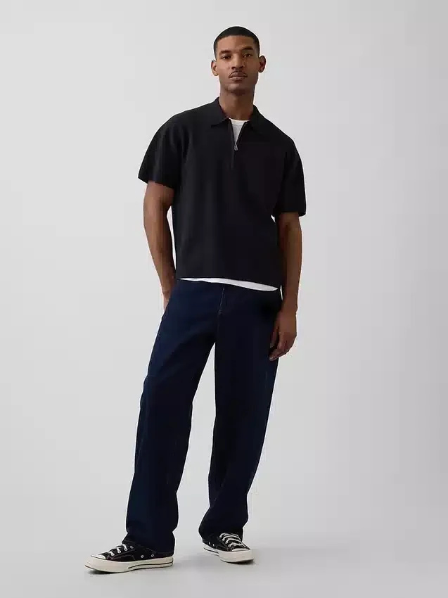 Maglia polo oversize con tasca e zip a un quarto