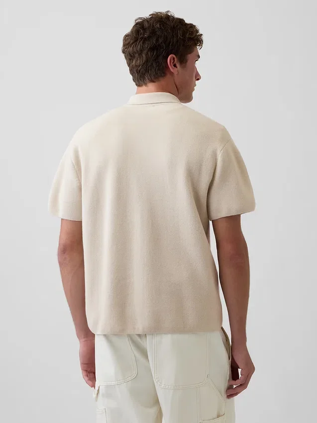 Maglia polo oversize con tasca e zip a un quarto