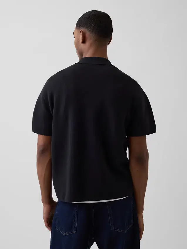 Maglia polo oversize con tasca e zip a un quarto