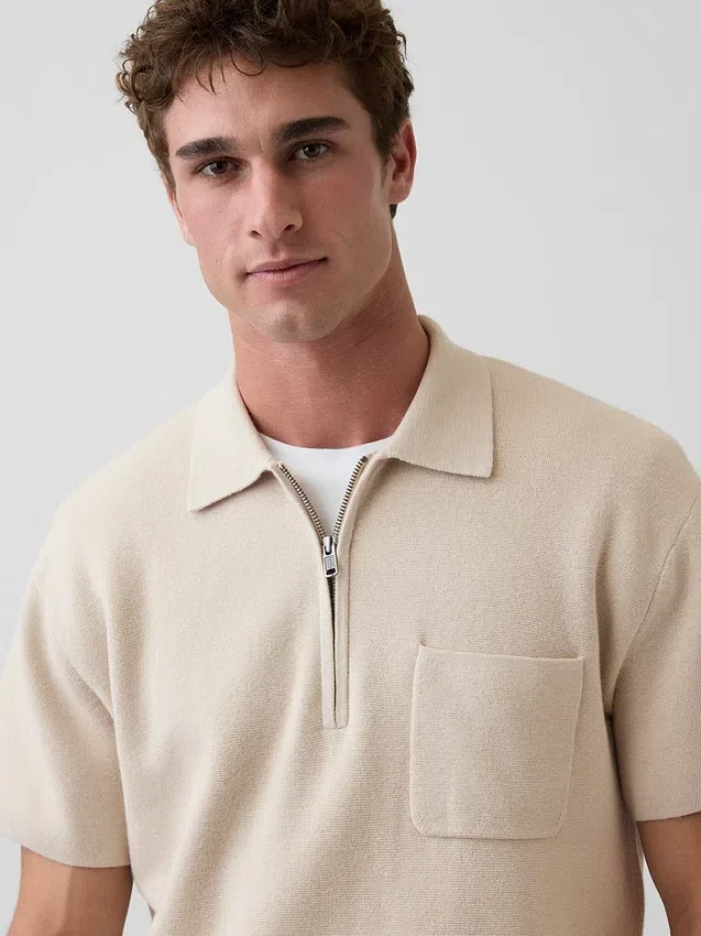 Maglia polo oversize con tasca e zip a un quarto