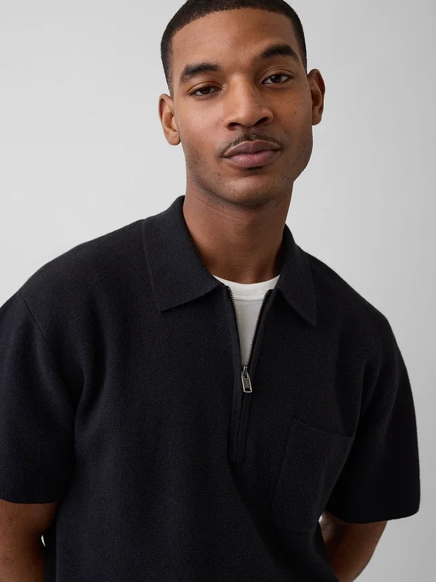 Maglia polo oversize con tasca e zip a un quarto