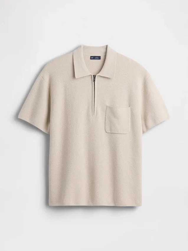 Maglia polo oversize con tasca e zip a un quarto