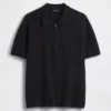 Maglia polo oversize con tasca e zip a un quarto