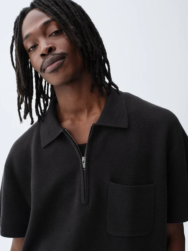 Maglia polo oversize con tasca e zip a un quarto