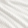 Maglione a collo alto corto a costine pointelle