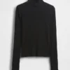 Maglione a collo alto corto a costine pointelle