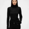 Maglione a collo alto in maglia pointelle