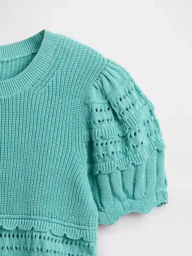 Maglione da bambino con bordi smerlati e punti misti