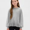 Maglione da bambino con peplo dal taglio morbido
