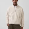 Maglione oversize in sherpa con mezza zip