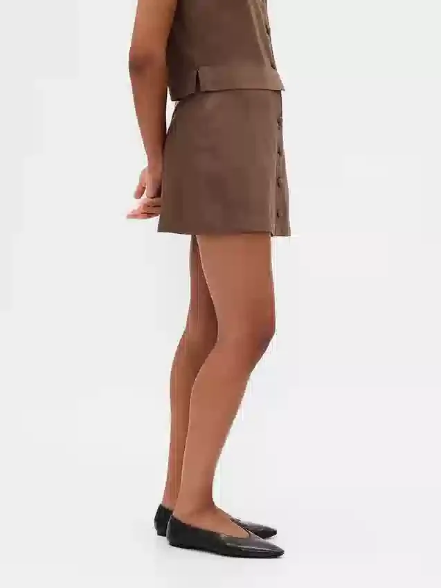 Mini gonna-pantaloncino con bottoni sul davanti in misto lino