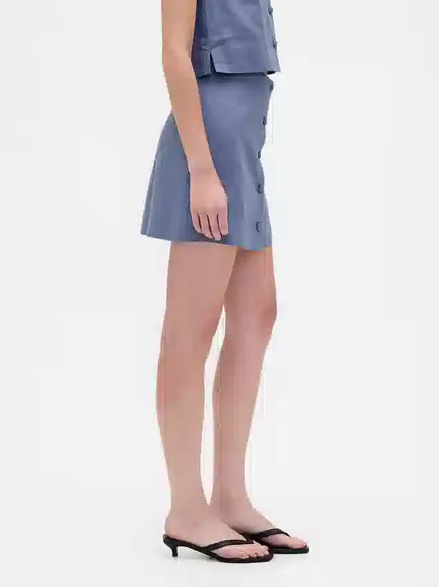 Mini gonna-pantaloncino con bottoni sul davanti in misto lino