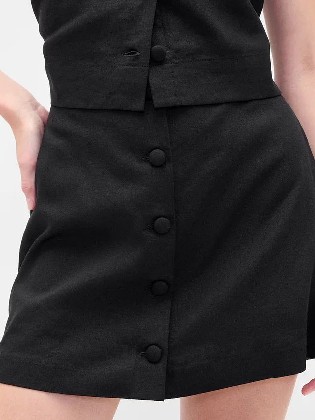 Mini gonna-pantaloncino con bottoni sul davanti in misto lino
