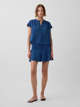 Mini gonna-pantaloncino in denim di garza di cotone con vita smockata