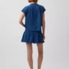 Mini gonna-pantaloncino in denim di garza di cotone con vita smockata
