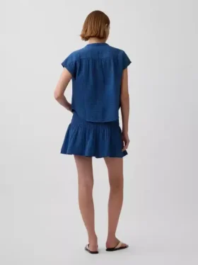Mini gonna-pantaloncino in denim di garza di cotone con vita smockata