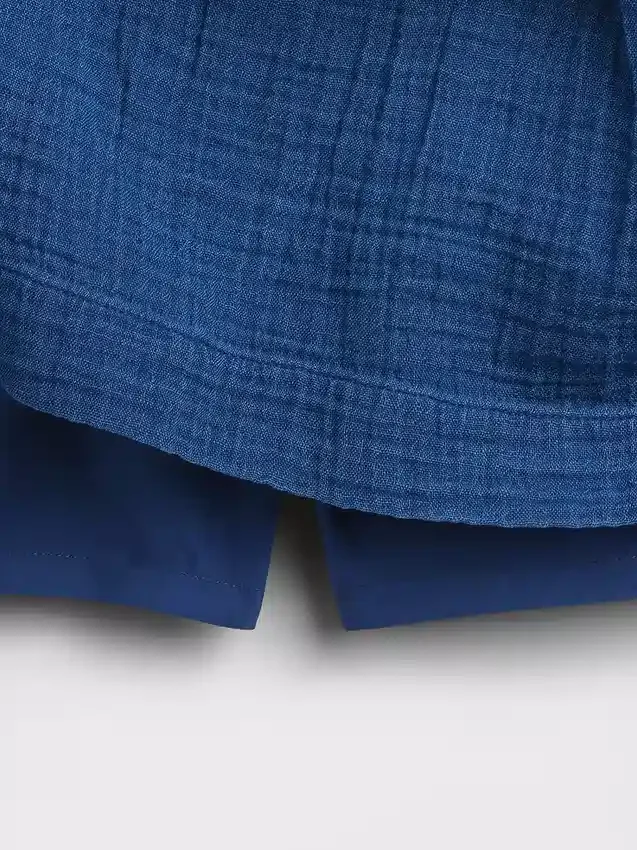 Mini gonna-pantaloncino in denim di garza di cotone con vita smockata