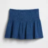 Mini gonna-pantaloncino in denim di garza di cotone con vita smockata