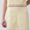 Mini gonna-pantaloncino in misto lino con bordi in pizzo