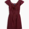 Minivestito con scollo rotondo e bordi in pizzo