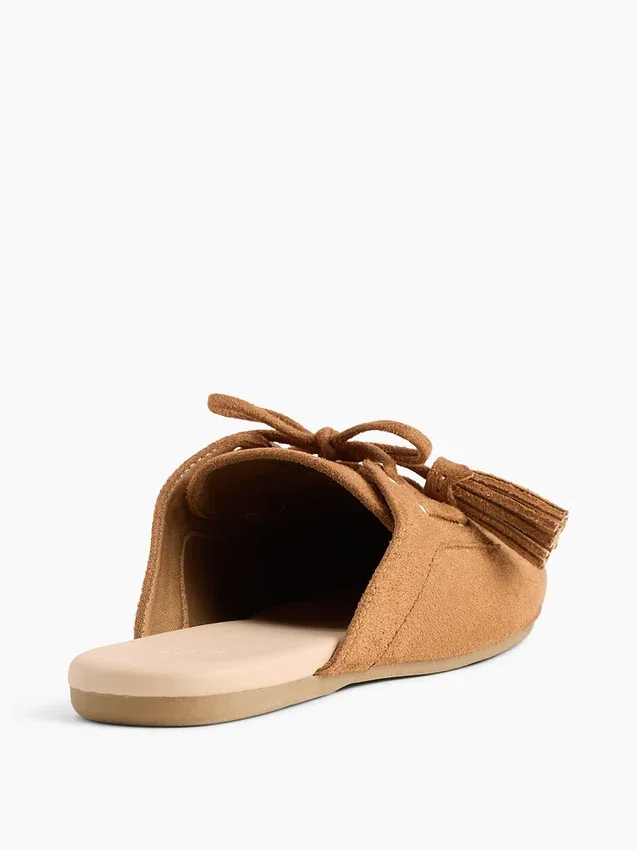 Mules vegane in pelle scamosciata con nappine