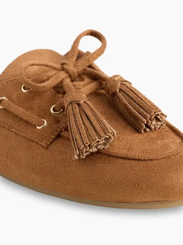 Mules vegane in pelle scamosciata con nappine