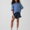 Pantaloncini corti in denim di garza di cotone per bambini con volant