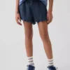 Pantaloncini corti in denim di garza di cotone per bambini con volant