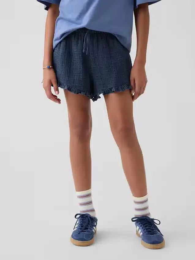 Pantaloncini corti in denim di garza di cotone per bambini con volant