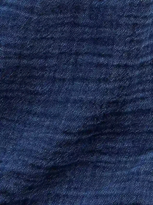 Pantaloncini corti in denim di garza di cotone per bambini con volant