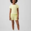 Pantaloncini da corsa a secco rapido con orlo a farfalla per bambini