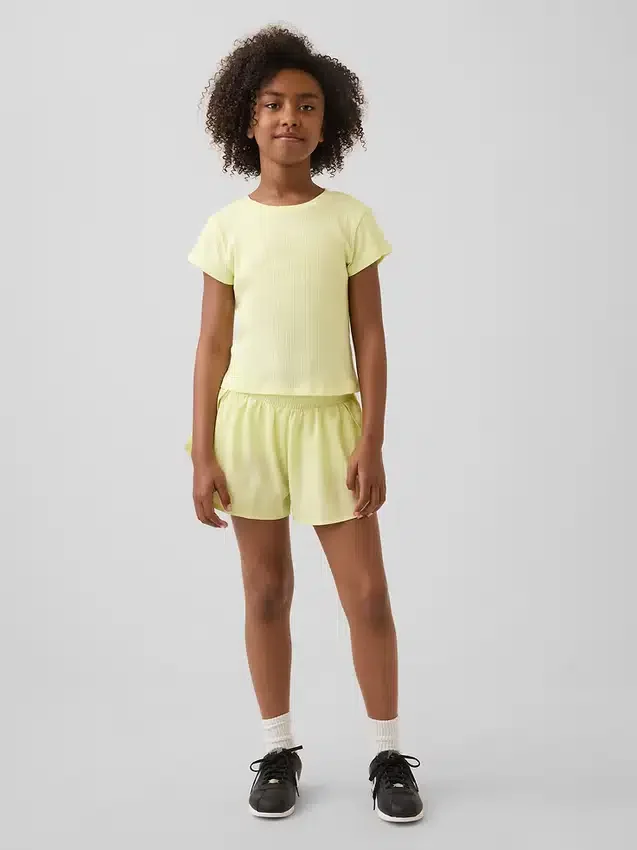 Pantaloncini da corsa a secco rapido con orlo a farfalla per bambini