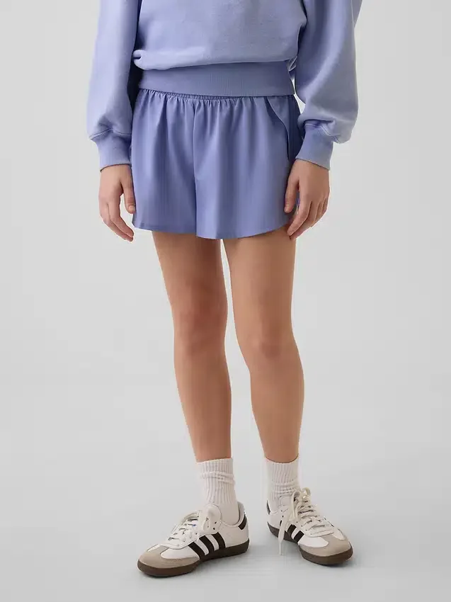 Pantaloncini da corsa a secco rapido con orlo a farfalla per bambini