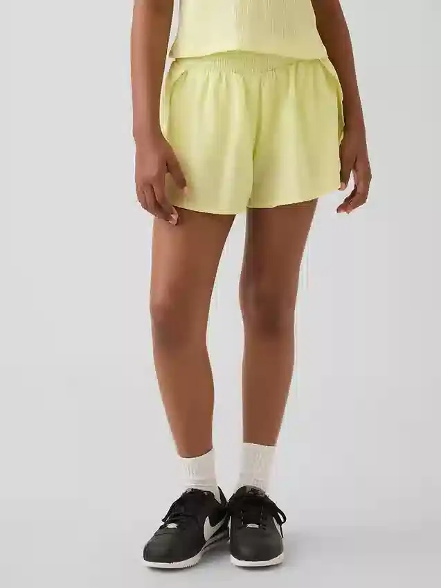 Pantaloncini da corsa a secco rapido con orlo a farfalla per bambini