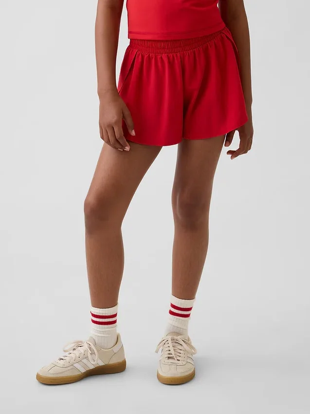 Pantaloncini da corsa a secco rapido con orlo a farfalla per bambini