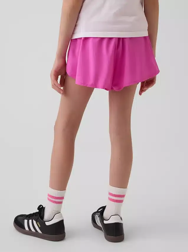 Pantaloncini da corsa a secco rapido con orlo a farfalla per bambini