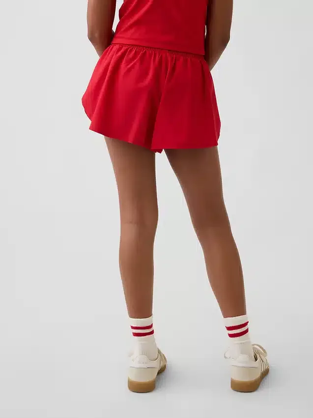 Pantaloncini da corsa a secco rapido con orlo a farfalla per bambini