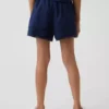 Pantaloncini facili da indossare in misto lino e cotone con bordi in pizzo per bambini
