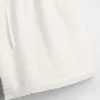 Pantaloncini facili da indossare in misto lino e cotone con bordi in pizzo per bambini
