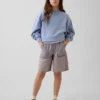 Pantaloncini in denim a vita bassa e linea allungata per bambini