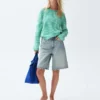 Pantaloncini in denim a vita media e linea allungata da 11"