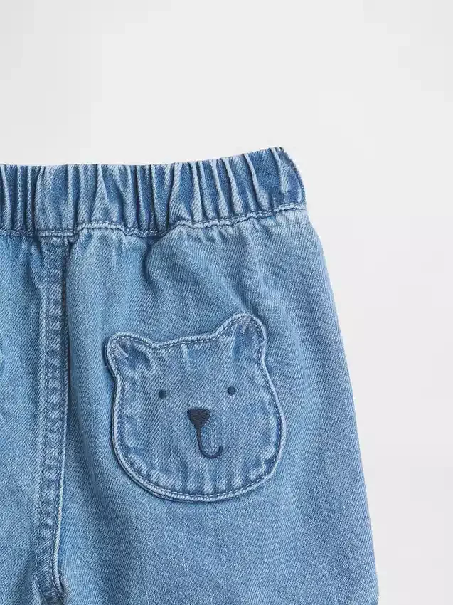 Pantaloncini in denim con tasche e orsetto Brannan per neonati