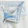 Pantaloncini in denim da bambino a vita bassa con ricamo a forma di limone