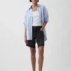 Pantaloncini in denim dal taglio ampio a vita media da 8"