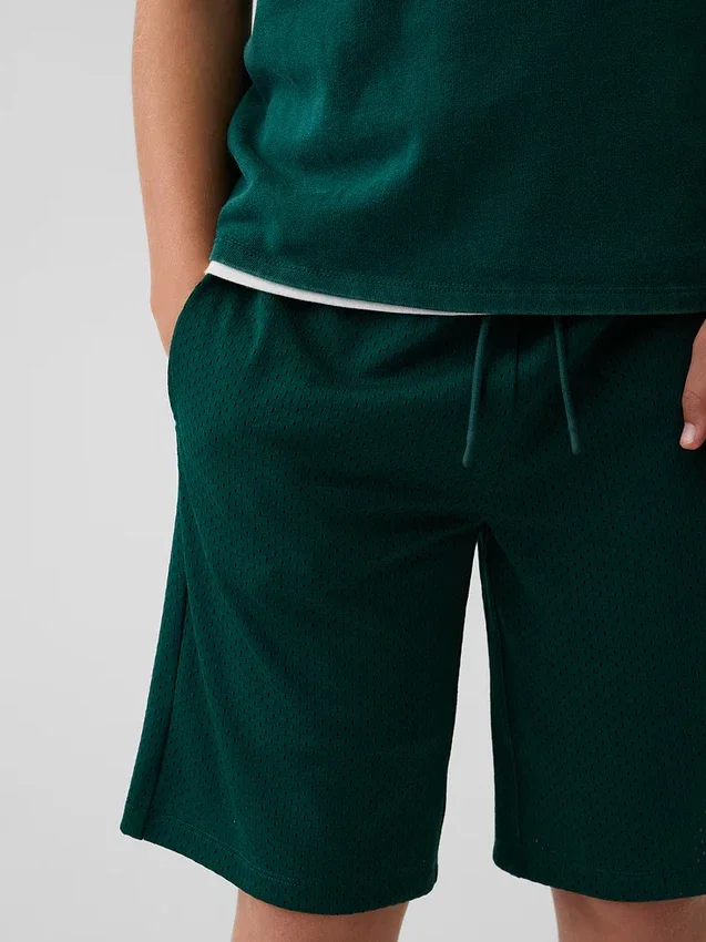 Pantaloncini sportivi in rete da bambino da 8"